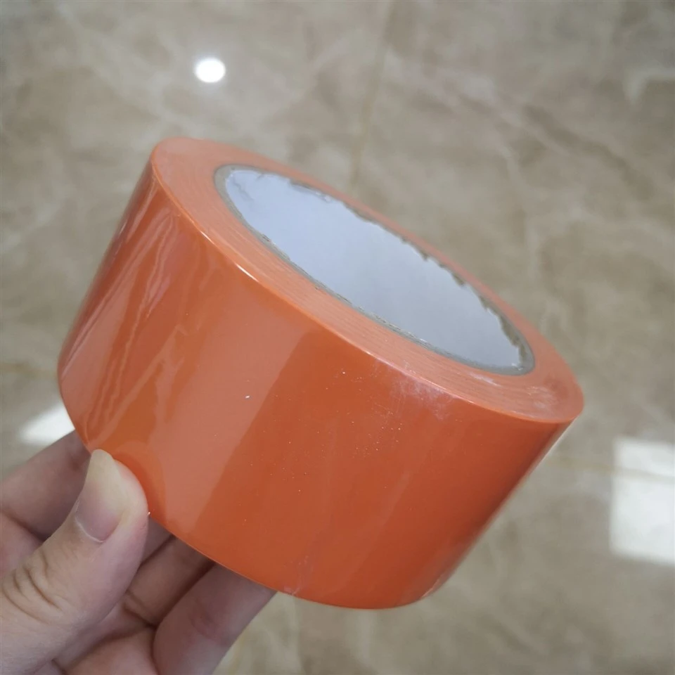 Low Tack Orange Pvc Tape in 50mm X 33m Rolls Used For Surface Protection During Construction factory